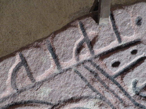 Detalj av några av de utvittrade runorna på runstenen U 721 i Löts kyrka, Uppland. Foto Magnus Källström